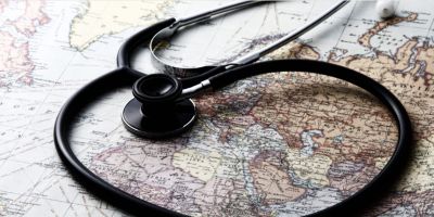 a stethoscope on a world map.
