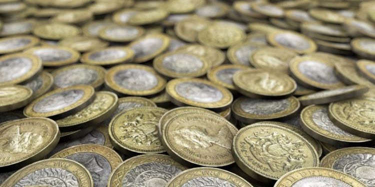 A pile of pound coins.