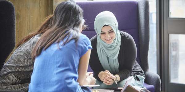 Group chatting in the Laidlaw Library