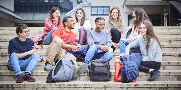 Group of student on steps outside social sciences building
