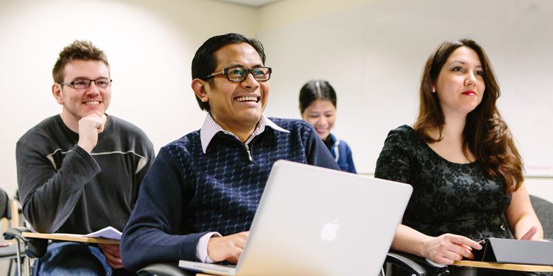 Masters students in a seminar room