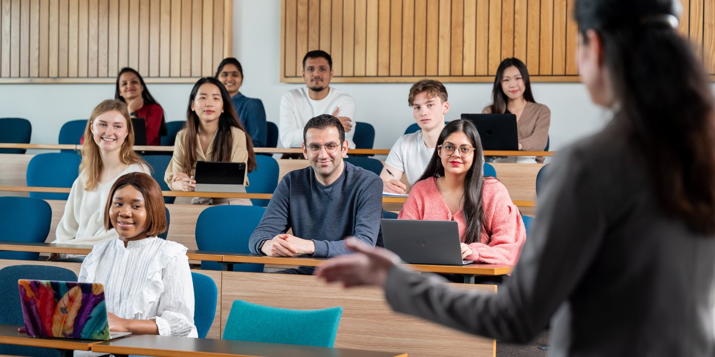 Academic giving lecture to group of students