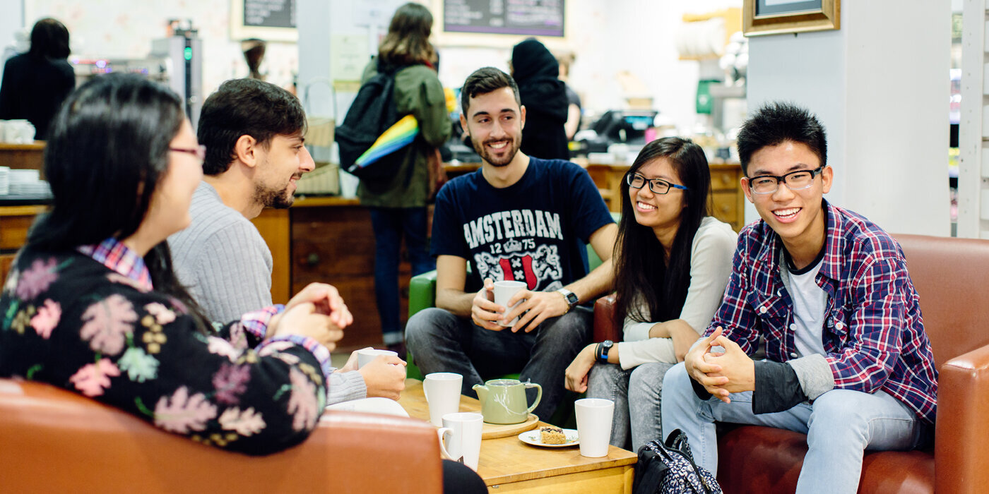 International students catching up over coffee at the Global Cafe.
