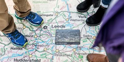 Students stood over a map of Leeds