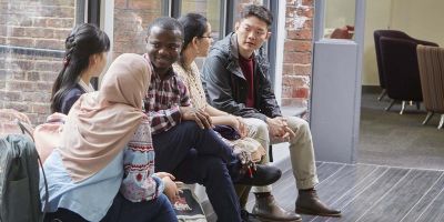 Group of postgraduate student sat talking