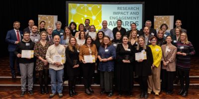 Winners of the University of Leeds Research Impact and Engagement Awards 2024 hold their awards