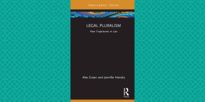 "Cover of the book Legal Pluralism: New Trajectories in Law by Alex Green and Jennifer Hendry. The cover has a minimalist design with a black background and a thin orange strip at the top displaying the publisher, 'Routledge Focus.'