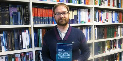 Peter Whelan with his latest book on EU Competition Law.