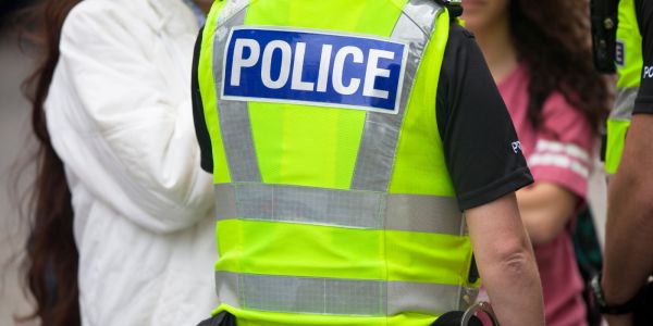 Policeman talking to members of the public