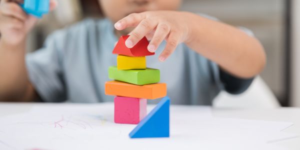child playing with building blocks