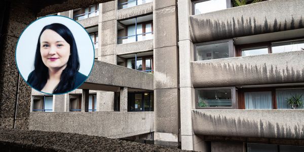 A view from a walkway on a Brutalist block of flats. Smiling photo of Dr Bainbridge in a circle frame to the left.
