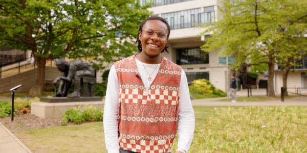 Sociology student standing on campus
