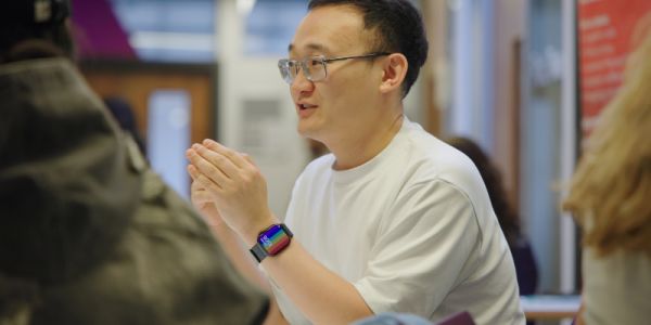 Student speaking to other students