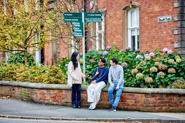 Students chat outside Hillary Place