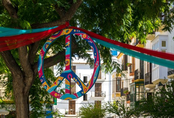 Image of nuclear peace sign hung from tree