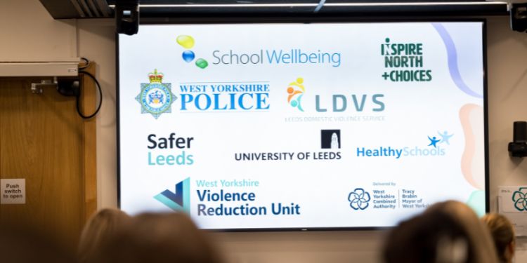 A screen with partner logos on it