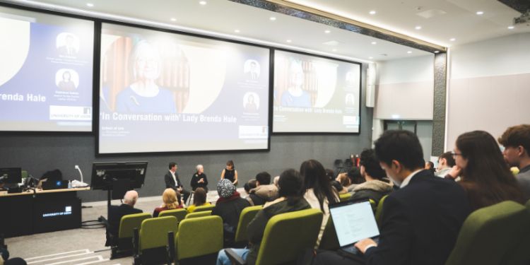 View of Lady Hale and the hosts from the middle of the lecture theatre