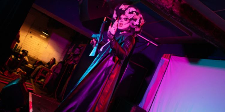 Nefarious de Vile performs a lip-sync on stage