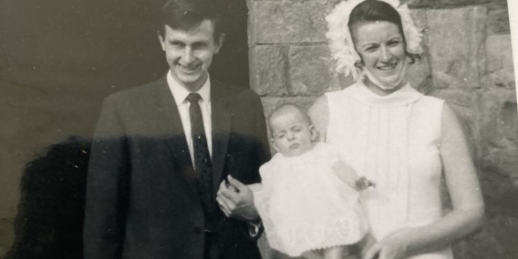 Black and white photo of Geoffrey and his wife at the christening of one of his children 