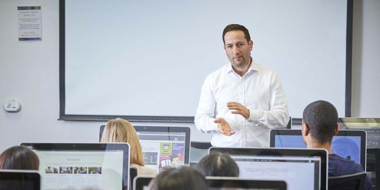 Dr Adam Tyson teaching in computer cluster