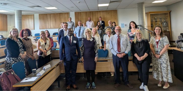 Photo of smiling attendees of the one-day international conference in July 2025 on money laundering in insolvency proceedings. 