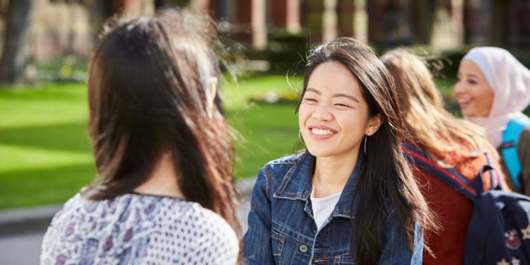 Undergraduate students laughing together