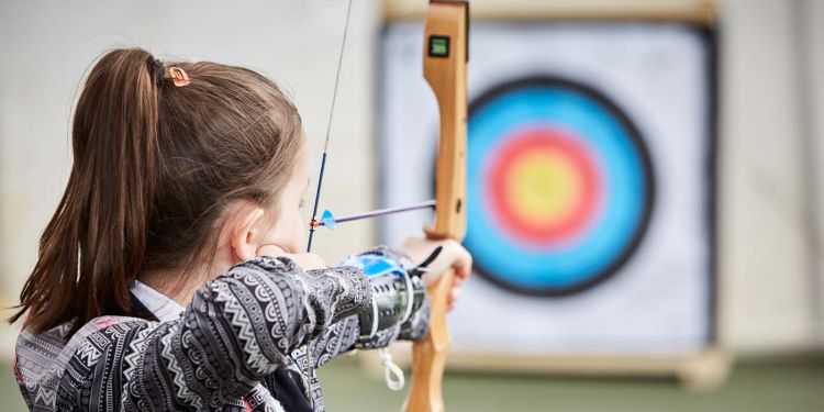 Student learning archery