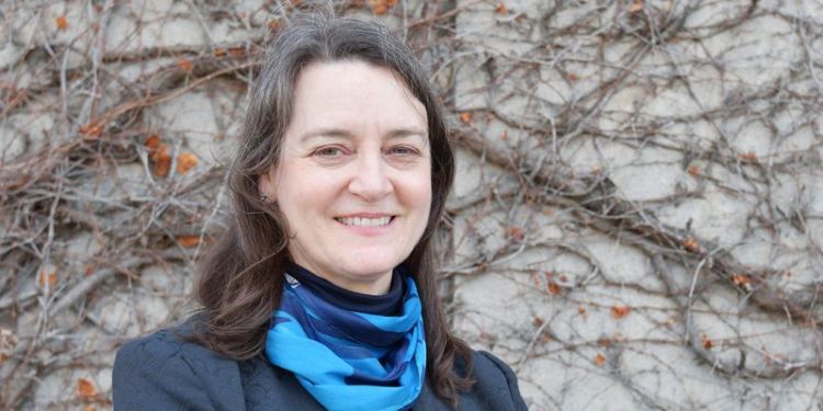 Close-up shot of Fiona Kay in front of a tree.