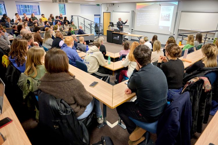 A full lecture theatre attends Professor Gallagher's lecture.