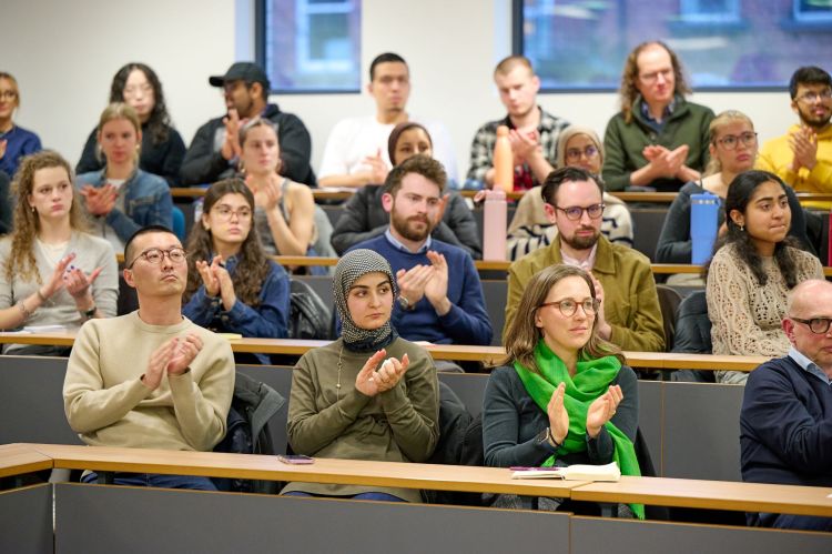 Audience applause at Professor Gallagher's lecture.