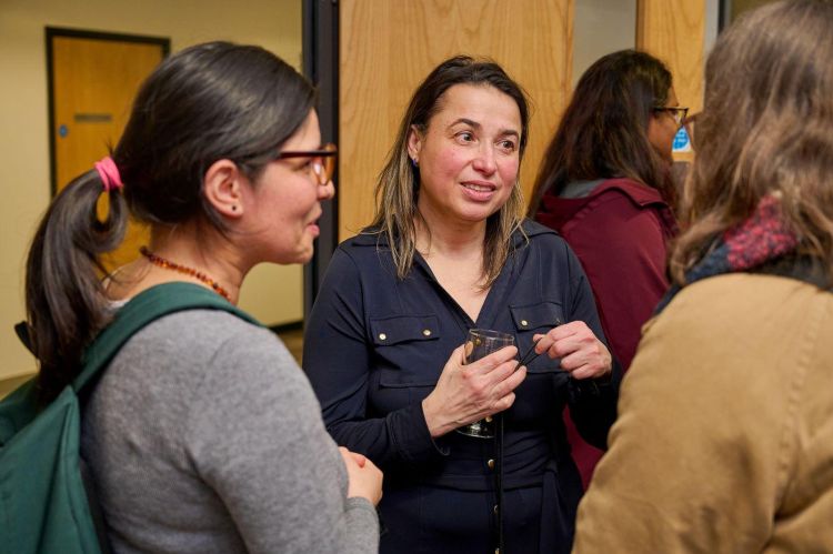 Photograph of Professor Manzano talking to friends and colleagues after her inaugural lecture.