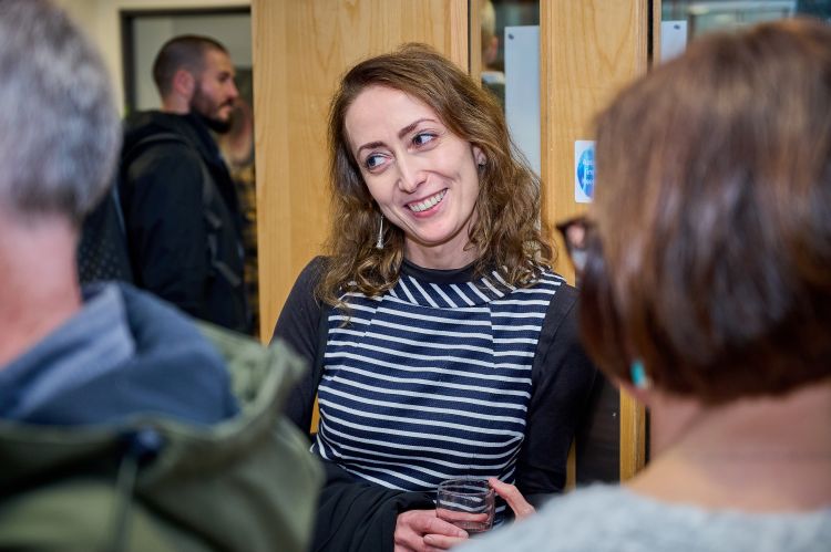 Viktoria speaking with colleagues  at the drinks reception after her lecture.