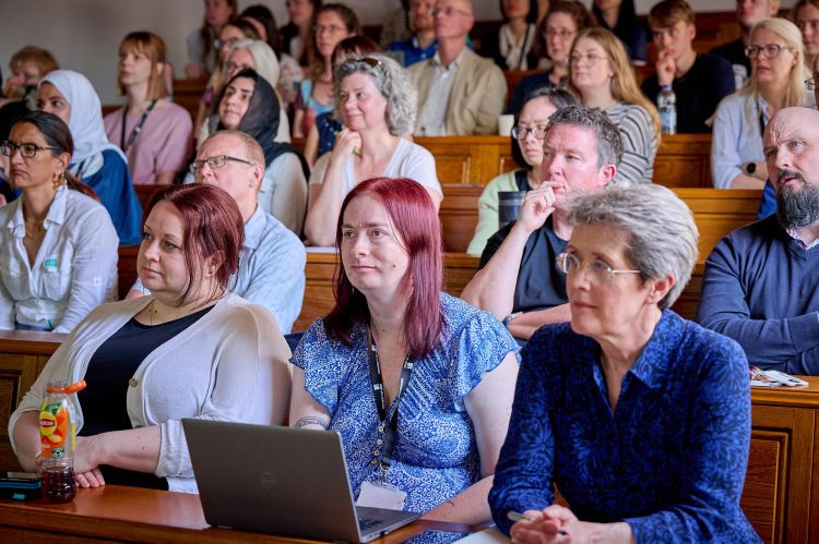 Photograph of audience listening to Professor Tracey's lecture.