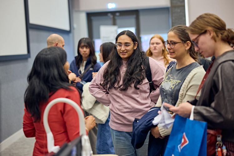 Manisha talking with students