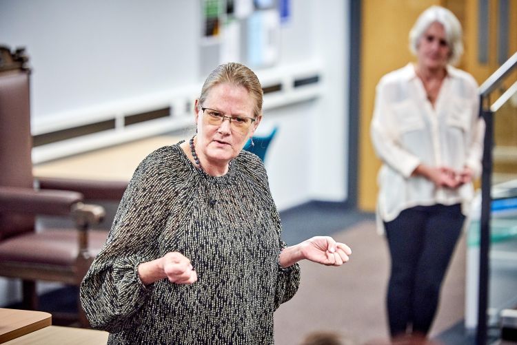 Professor Pecorari answering audience questions. Prof. Ruth Swanwick, who chaired the Q&A, standing in the background 