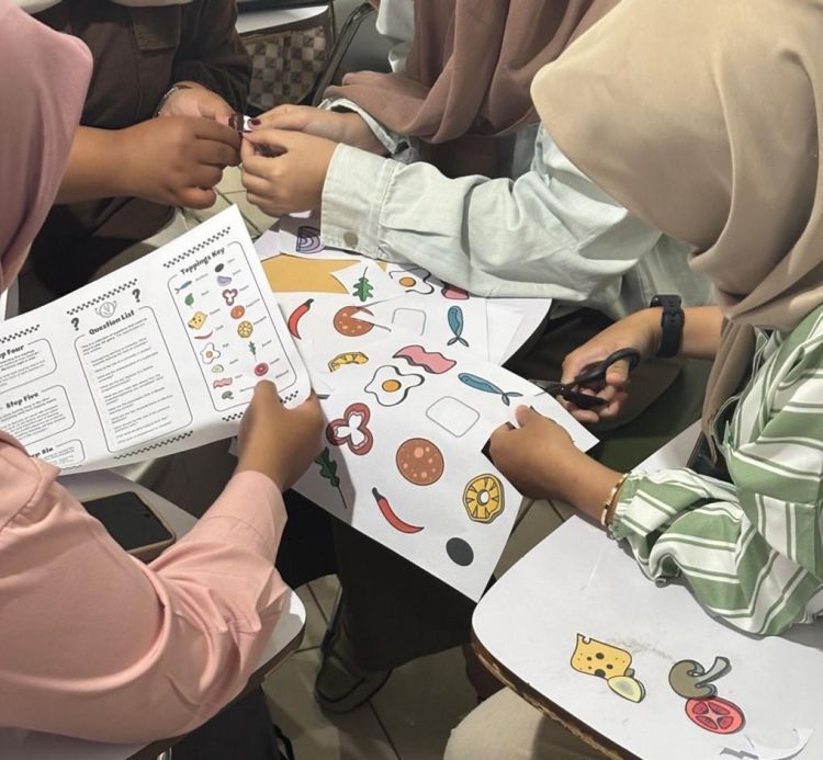 Students discussing which toppings to include in their pizza