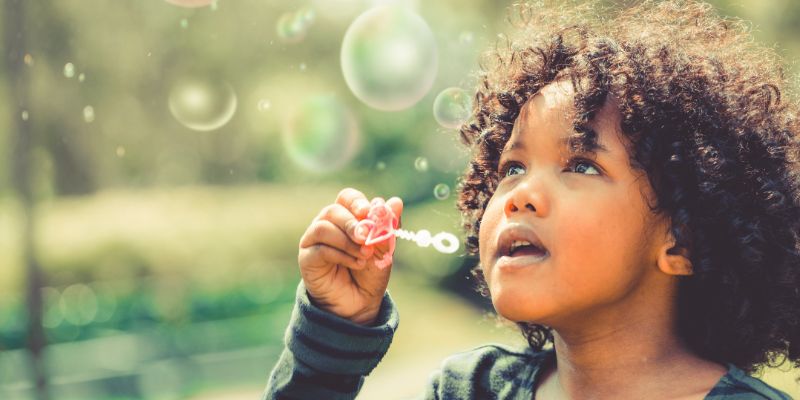 Child blowing bubbles