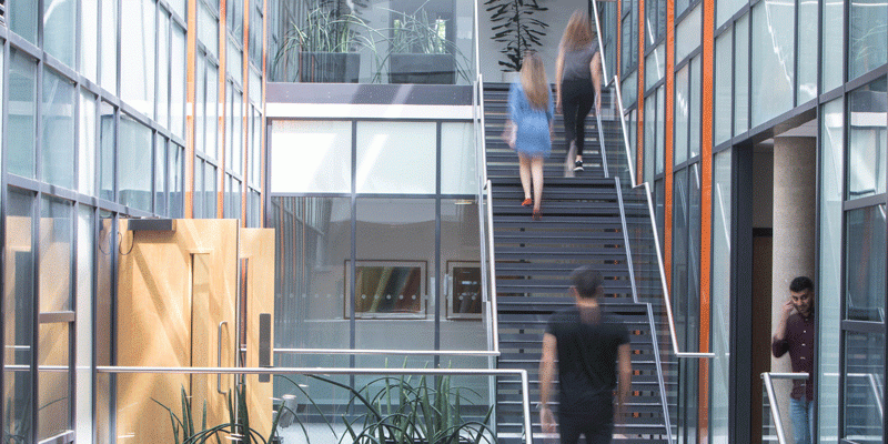 students on Liberty Building staircase