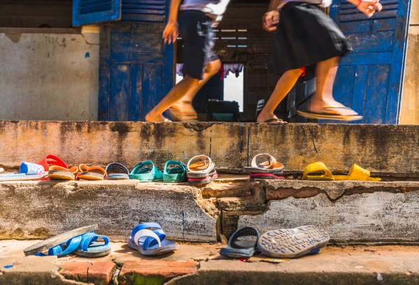 School in Africa with shoes lined up outside